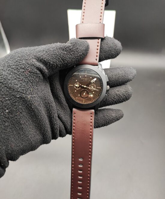 Fossil men's watch with brown dial, black case, multi-function display, and brown leather strap