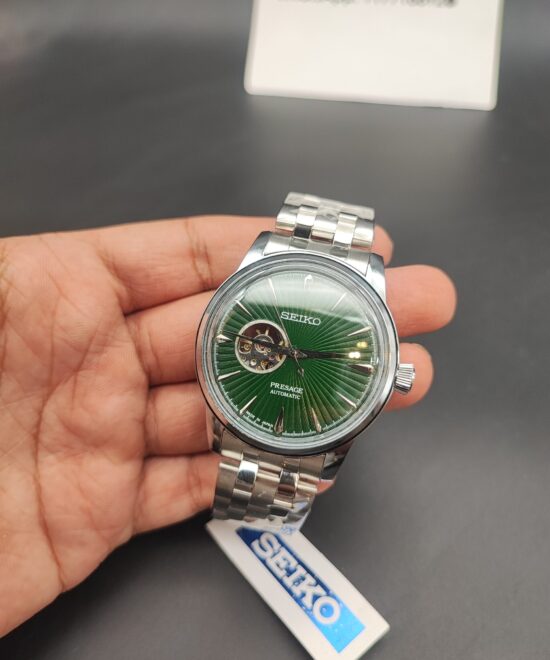 Seiko Presage automatic open-heart watch with emerald green sunburst dial and stainless steel bracelet