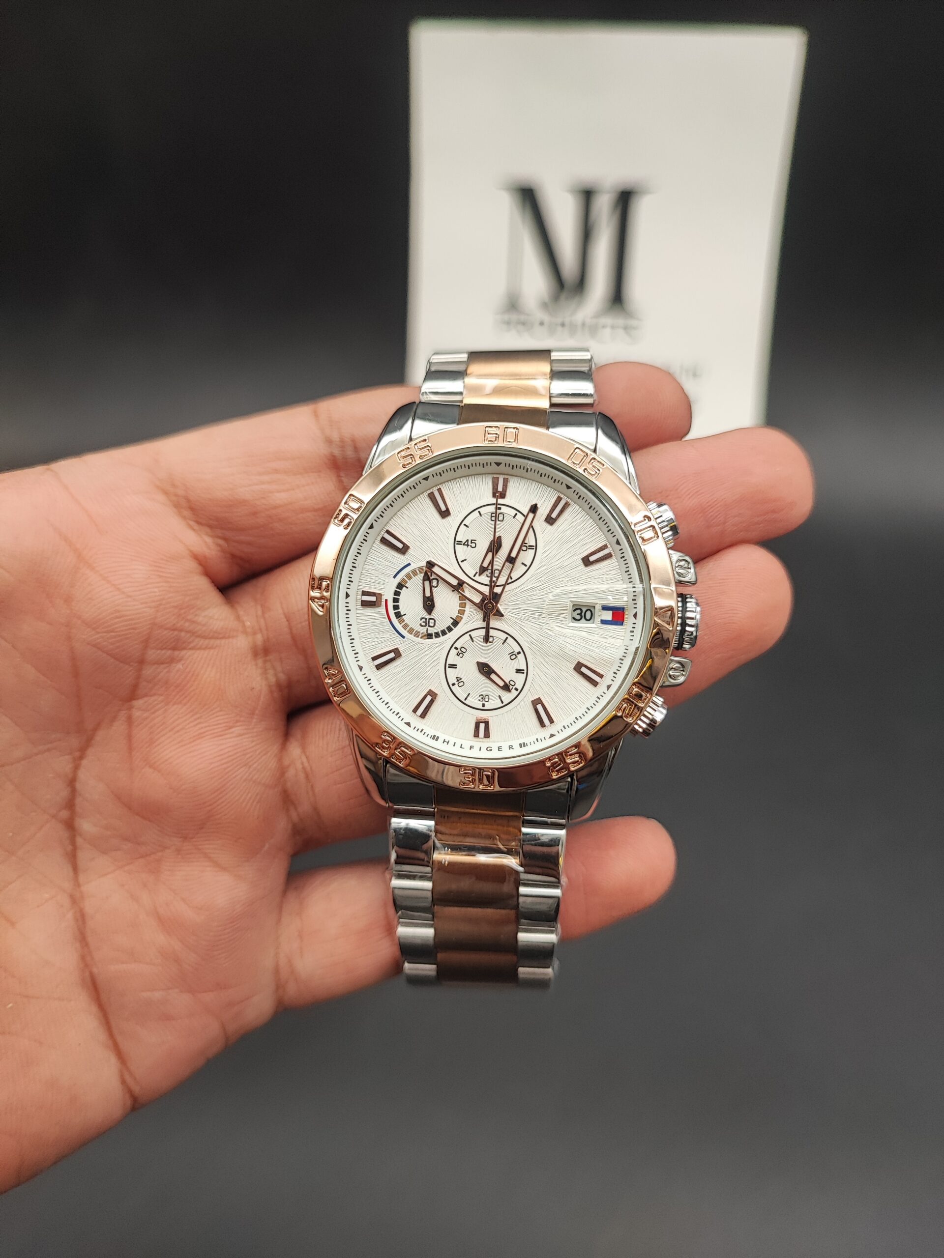 Tommy Hilfiger men's quartz chronograph watch with stainless steel bracelet link strap and blue dial face